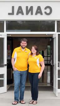 two resident directors standing outside a residence hall