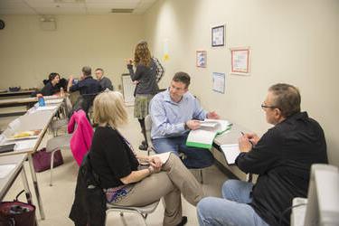 First year faculty meeting in small groups.