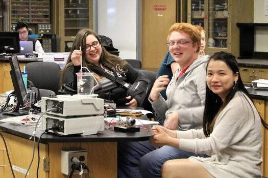 Students at a computer workstation in the Physics Labs