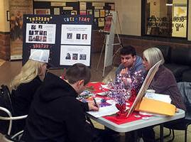 Student volunteers registering peers to vote