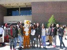 students on Buff State campus with Benji the Bengal mascot