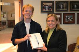 student winner #2 being handed an Ipad