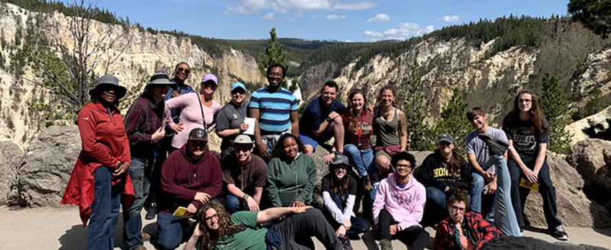 Students in front of the Lower Falls of the Yellowstone River in Yellowstone National Park